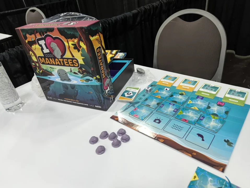 I Heart Manatees box and game setup on a table.